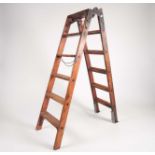 'The Handy Ladder', an early 20th century pine and wrought iron fitted, folding step ladder /
