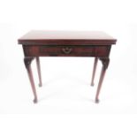 A George II mahogany tea table, the rectangular hinged top above a single frieze drawer, raised on