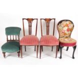 Two Victorian nursing chairs, one upholstered in a rose tapestry on ebonised cabriole legs with