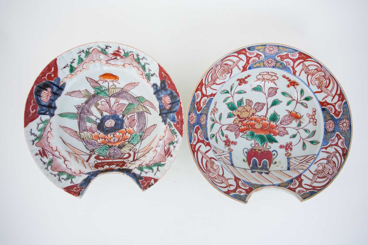 Two Japanese Imari barbers bowls, l7th century, one with moulded lobed rim, each with two pierced