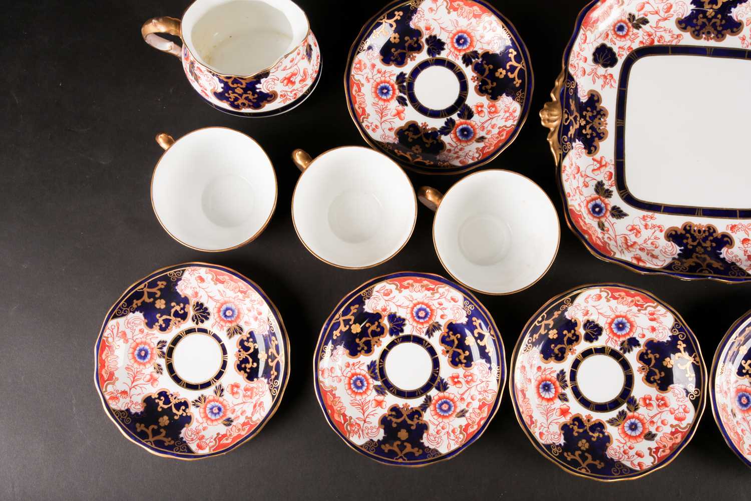 An Edwardian Royal Crown Derby Imari pattern part tea service, for nine place settings, to include a - Image 7 of 10