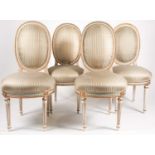 A set of four Louis XVI style ivory and copper green painted and parcel-gilt 'cameo' back salon