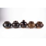 Five Chinese Henan jarlets, with various brown to black glazes, one with a short neck and