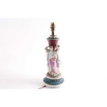 A late 19th century french biscuit porcelain table lamp, modelled with three classical greek