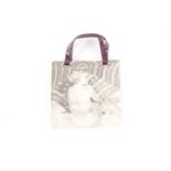 Anya Hindmarch. A canvas tote handbag, featuring a black and white image of a woman sunbathing, with