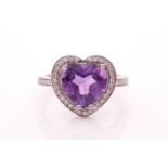 An 18ct white gold, diamond, and amethyst ring, set with a mixed heart-shaped amethyst within a
