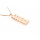 A 9ct yellow gold ingot pendant, hallmarked to front, 4.1 cm long, suspended on a 9ct box-link chain