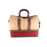 A Vintage Gucci of Italy tan canvas and leather holdall/ weekend bag zipped bottom section with a