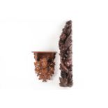 A Black forest carved wall bracket, circa 1900, the shaped self above hunting trophies, leaves and