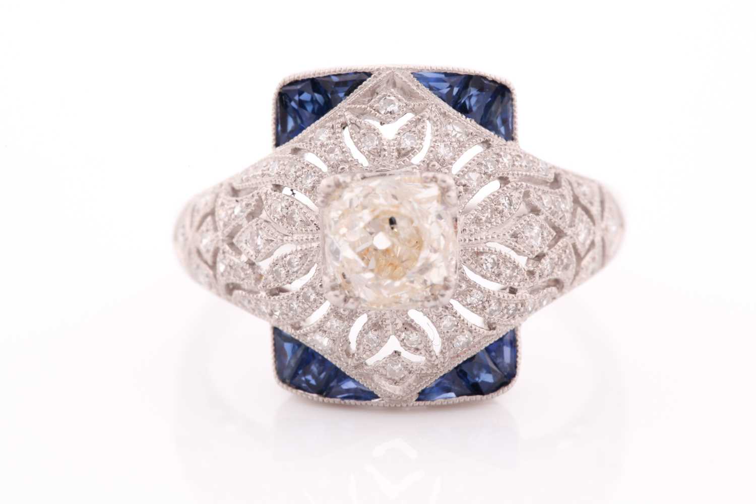 An unusual diamond and sapphire ring, in the Art Deco style, centred with an old cushion-cut - Image 5 of 5