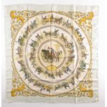 A Hermes silk square scarf printed with La Promenade De Longchamps pattern in yellow and tones of
