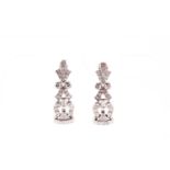 A pair of platinum and diamond articulated drop earrings, set with eight-cut diamonds of