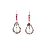 A pair of yellow metal, diamond, and ruby drop earrings, the silver mounts inset with rose-cut