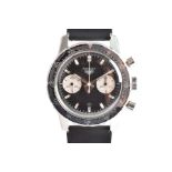 A rare 1967 Heuer Autavia ref. 7763 stainless steel mechanical chronograph wristwatch the black dial