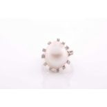 A diamond and cultured Baroque pearl cocktail ring, the pearl measuring approximately 1. 7x 1.35,