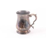 A George III silver baluster tankard with capped double scroll handle. London 1761 by William and