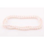 A cultured pearl necklace, comprised of freshwater pearls of approximately 8-9 mm diameter, the