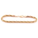 A multi-strand rope twist bracelet; with trigger clasp, stamped '585', 17.8 cm length. 7.3 grams