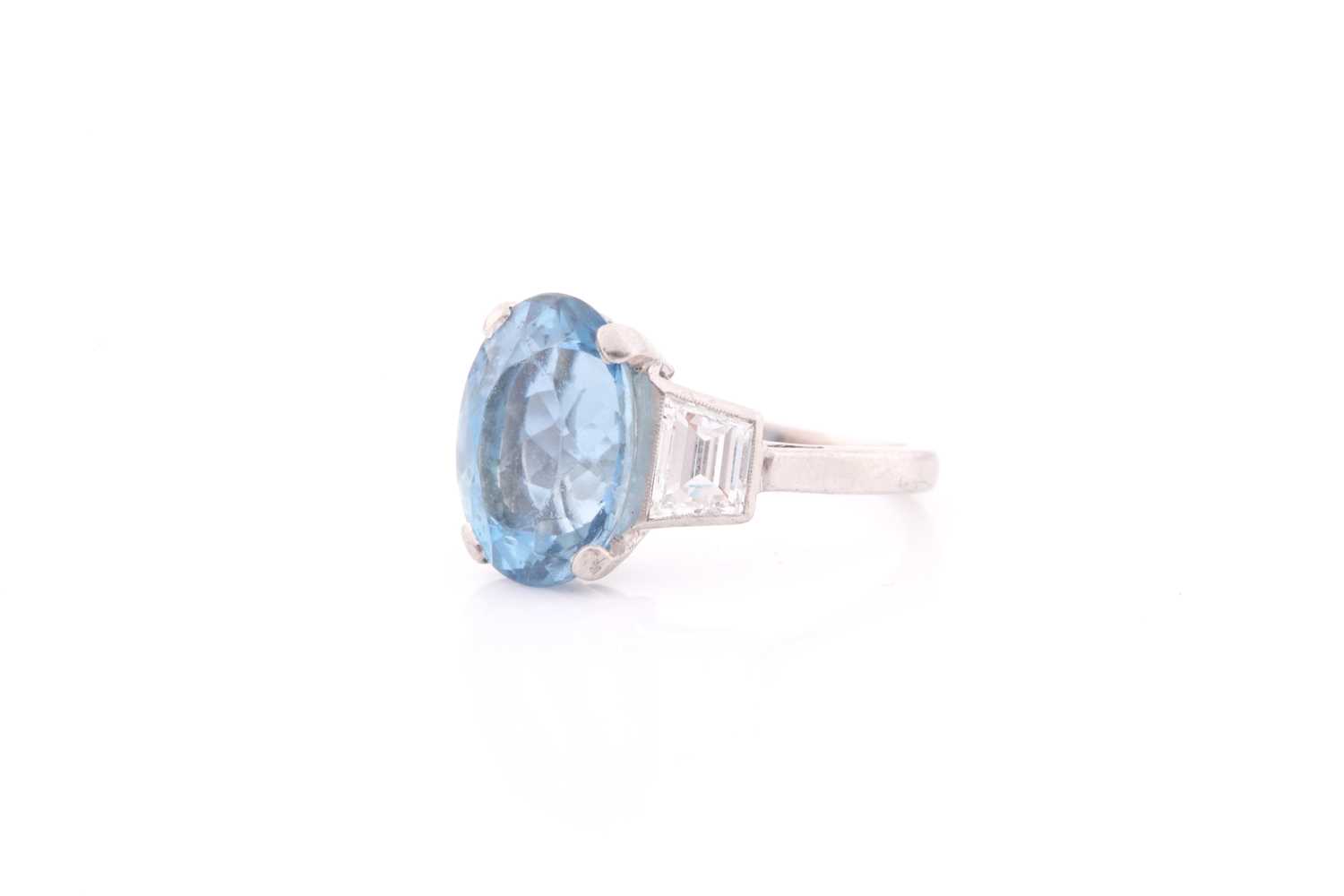 A diamond and blue topaz ring, set with a mixed oval-cut topaz, measuring approximately 12 x 8.5 mm, - Image 3 of 4