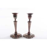 A pair of silver candlesticks; Sheffield 1989 by David Shaw Silverware shaped oval with tapering