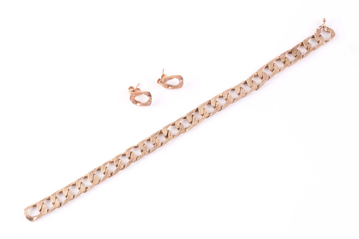 A 9ct yellow gold flattened curb-link chain bracelet, approximately 17.5 cm long, together with a