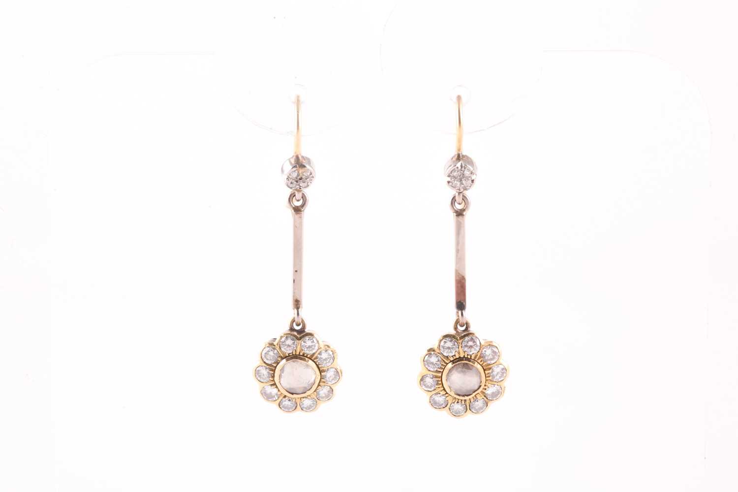 A pair of diamond cluster drop earrings, the floral mounts inset with a rose-cut diamond within a