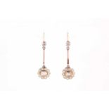 A pair of diamond cluster drop earrings, the floral mounts inset with a rose-cut diamond within a