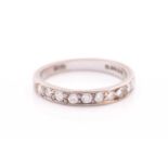An 18ct white gold and diamond half eternity ring, set with ten round-cut diamonds of
