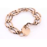 A 9ct yellow gold gate-link bracelet, approximately 17 cm long, fastened with a safety chain and a