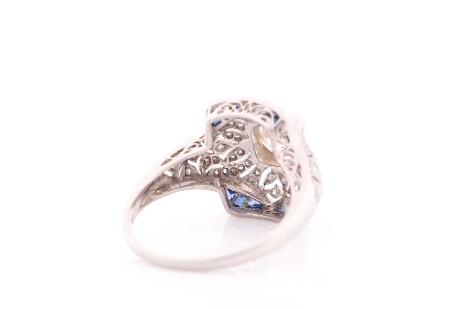 An unusual diamond and sapphire ring, in the Art Deco style, centred with an old cushion-cut - Image 4 of 5