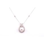 An 18ct white gold, diamond, and South Sea pearl pendant, set with a round white pearl approximately