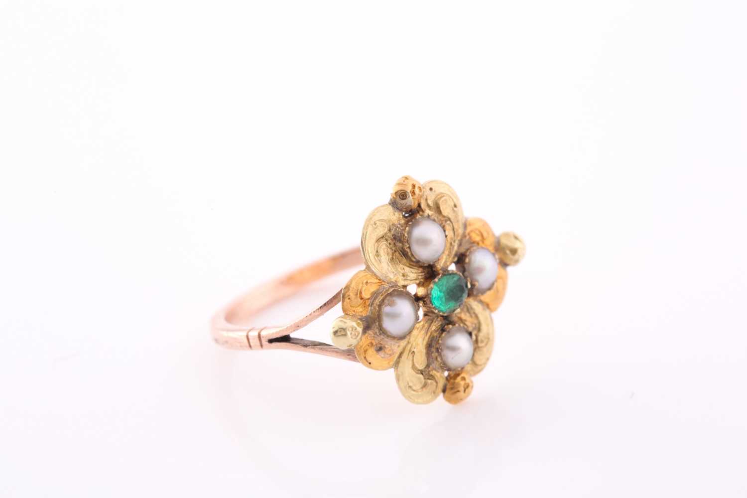 A 19th century yellow metal, emerald, and pearl ring, the quatrefoil mount with lightly engraved - Image 3 of 4