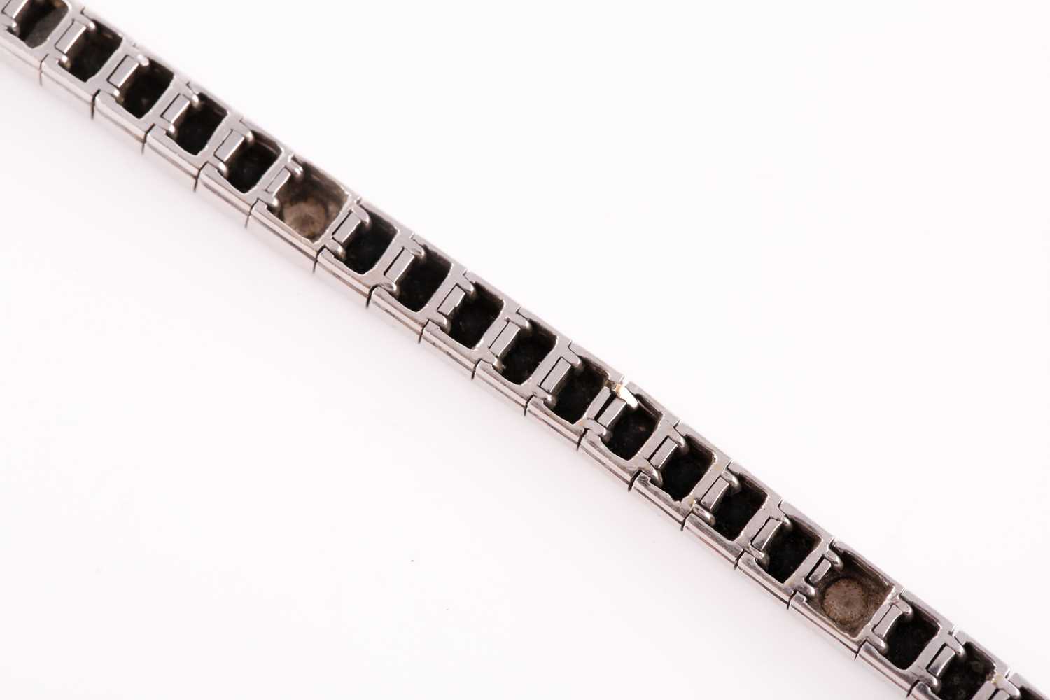 An 18ct white gold, diamond, and onyx line bracelet, the segments set with square-cut black onyx, - Image 4 of 6