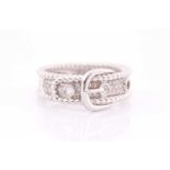 An 18ct white gold and diamond buckle ring, the mount pave-set with round brilliant-cut diamond