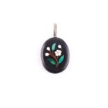 A silver and black hardstone pendant locket, the back inset with a pietra dura design of a flower