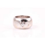 A single stone diamond dress ring, the heart-shaped diamond in raised rub-over mount within a wide