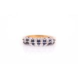 A sapphire and diamond half hoop ring; the round brilliant cut diamonds and circular cut sapphires