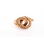 An 18ct yellow gold ring, of unusual knotted design with textured wire finish, marked to shank, size