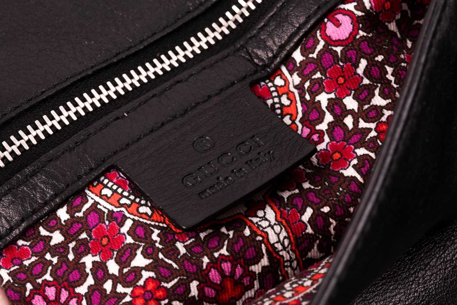 Gucci. A black leather handbag, with chrome fittings and wide shoulder strap, paisley material - Image 2 of 11