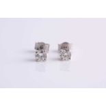 A pair of platinum and diamond ear studs, the round brilliant-cut diamonds of approximately 0.45