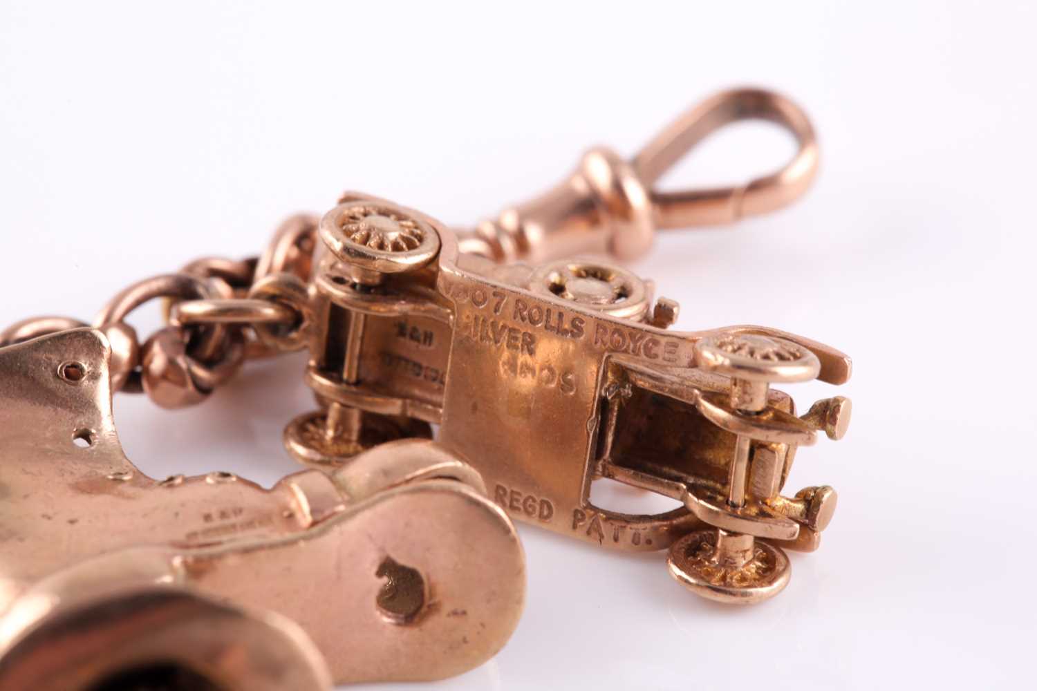 A yellow metal converted watch chain charm bracelet, suspended with yellow metal and silver gilt - Image 3 of 5