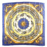 Hermes, Paris. A polychrome zodiac scarf, with dark blue border, together with a Hermes scarf with