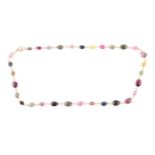 A 14ct yellow gold and varicoloured tourmaline necklace, comprised of briollete-cut pear, oval,