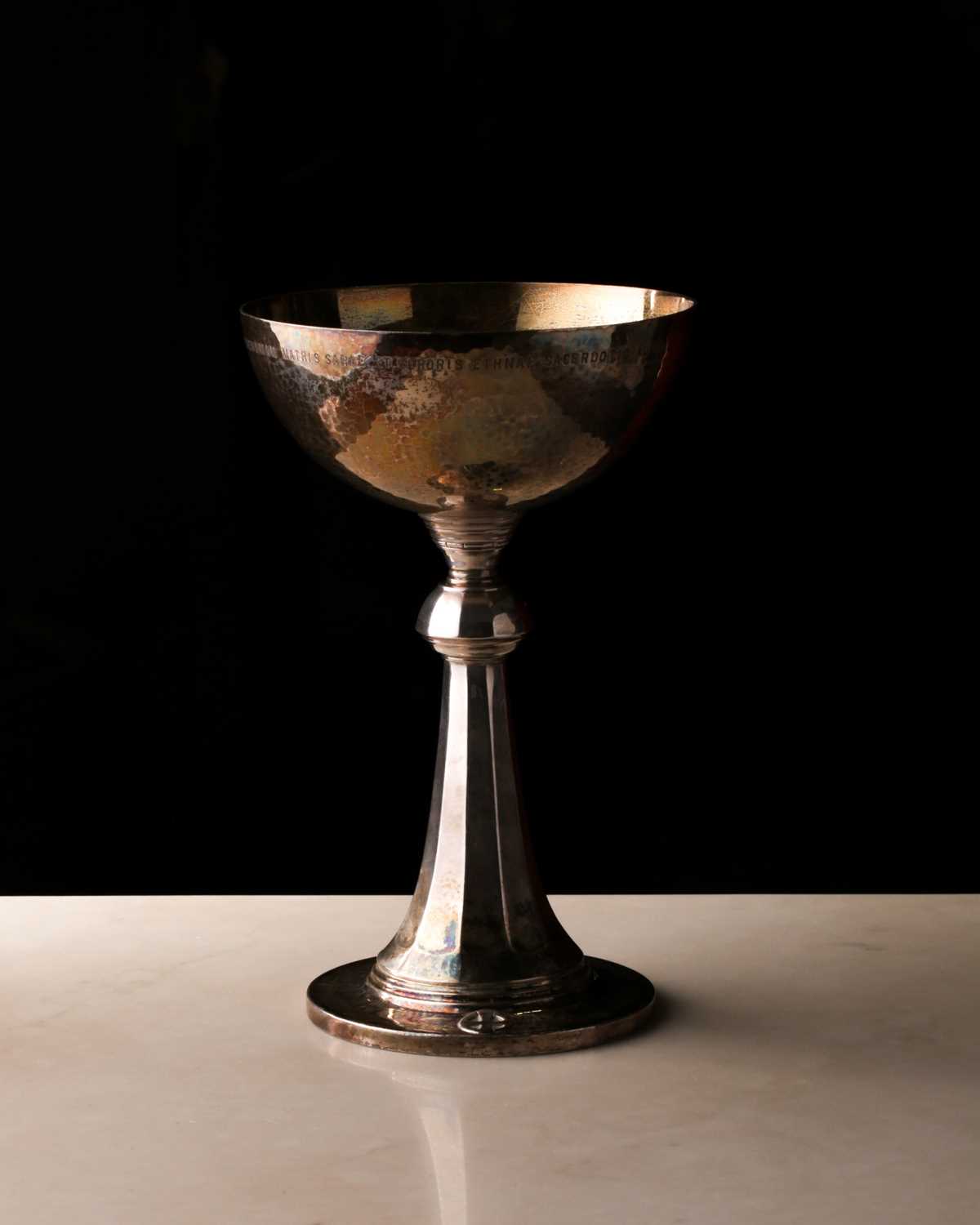 A Georg Jensen silver ecclesiastical chalice. bearing import marks for London 1929. With memorial