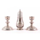 A pair of 20th-century silver squat dressing table candlesticks with loaded bases. Probably