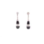 A pair of 18ct white gold, diamond and onyx drop earrings, in the Art Deco taste, each tapered