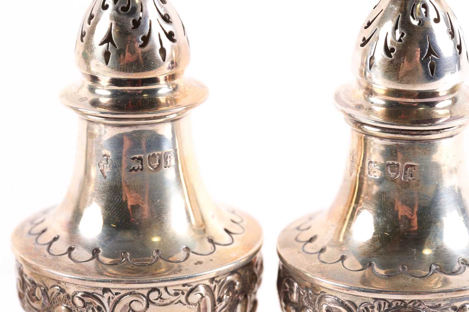 A late Victorian three-piece silver cruet set, London 1901 by Mappin Brothers, with embossed - Image 2 of 5