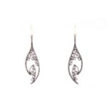 A pair of diamond drop earrings, the silvered openwork mounts inset with mixed old and rose-cut