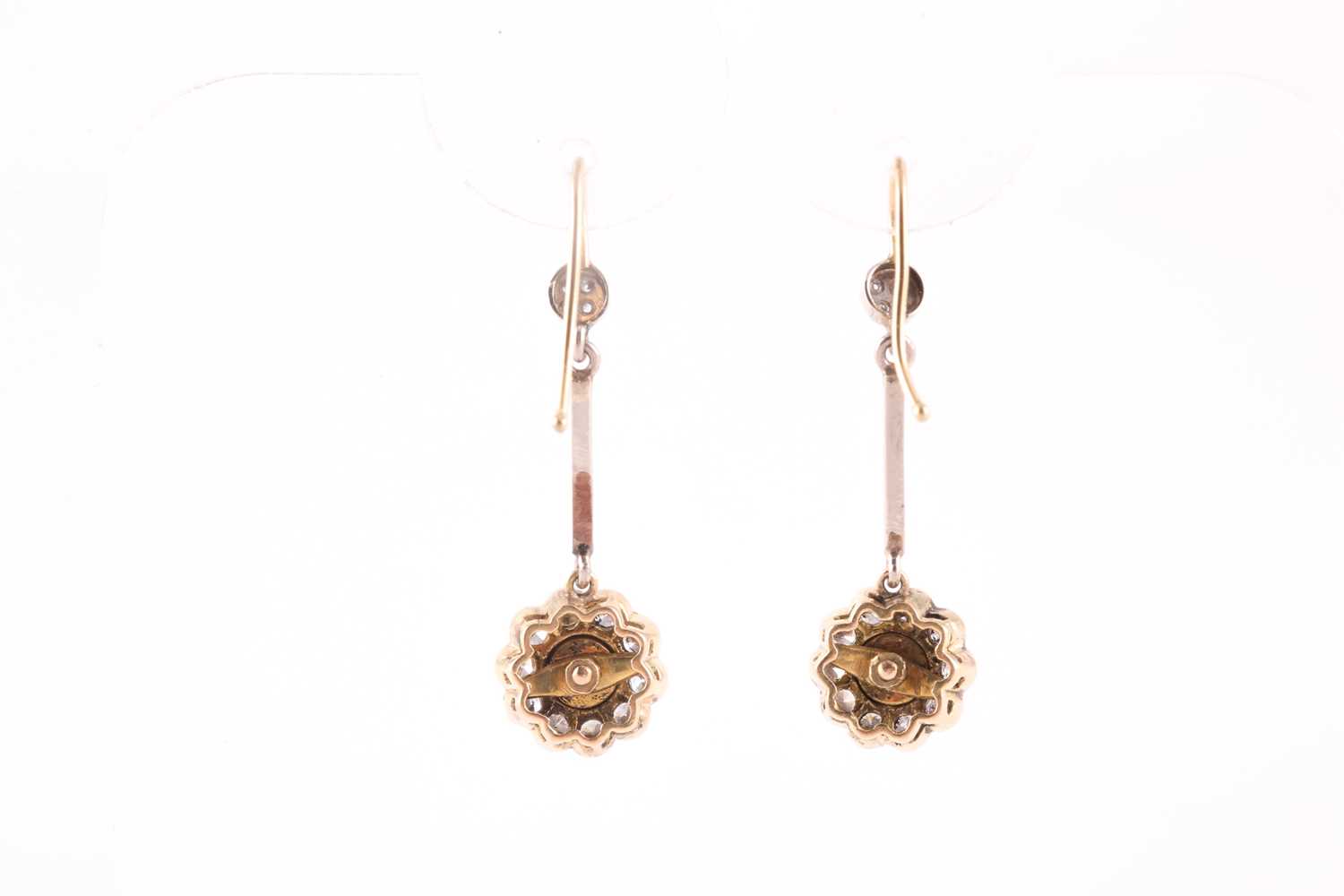 A pair of diamond cluster drop earrings, the floral mounts inset with a rose-cut diamond within a - Image 2 of 2