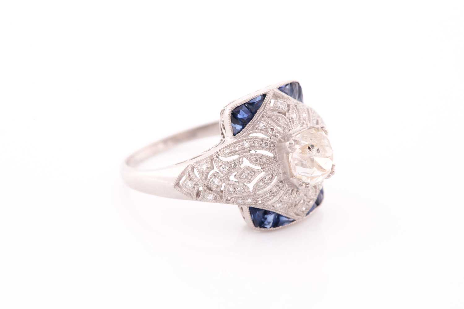 An unusual diamond and sapphire ring, in the Art Deco style, centred with an old cushion-cut - Image 3 of 5